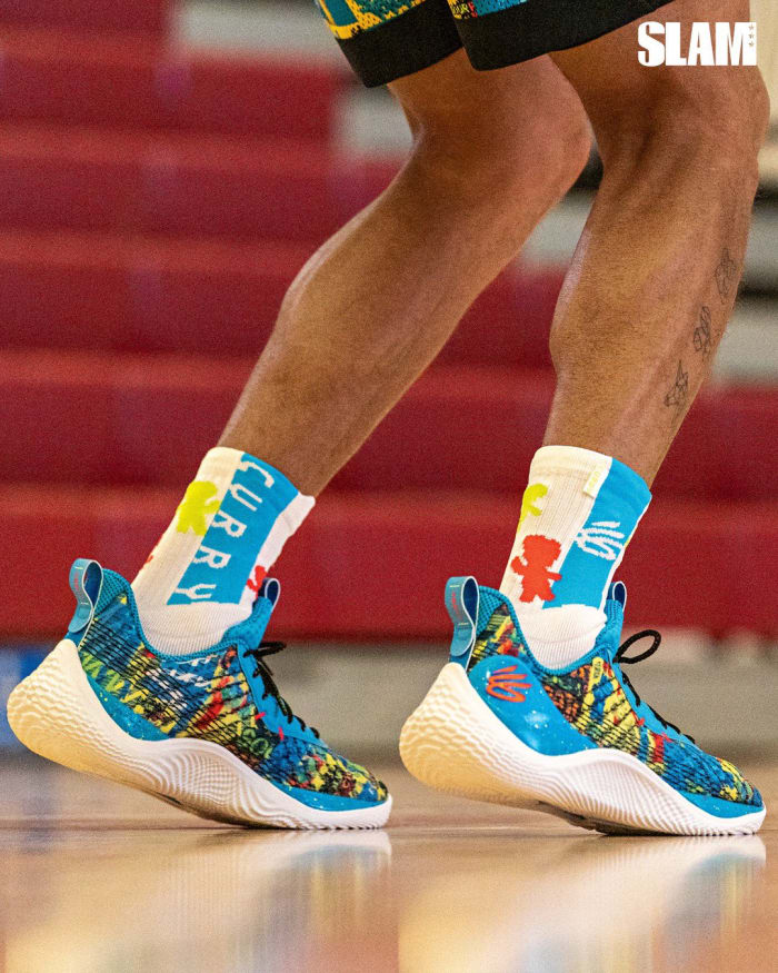 View of blue, yellow, and Curry 10 shoes.